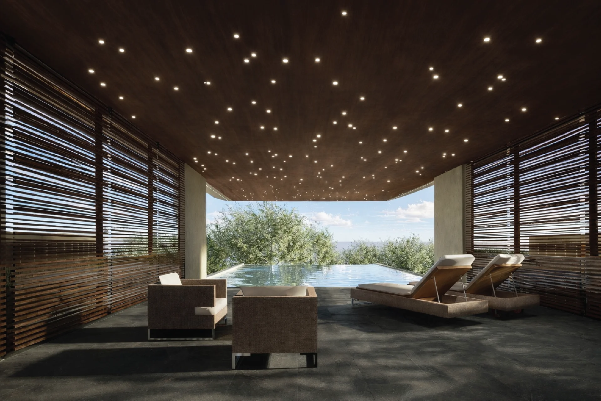 A luxury outdoor terrace features a dark wood ceiling with integrated fiber-optic starlight lighting and wooden slat walls. The space includes two lounge chairs and two armchairs facing a sleek infinity pool overlooking lush green trees.